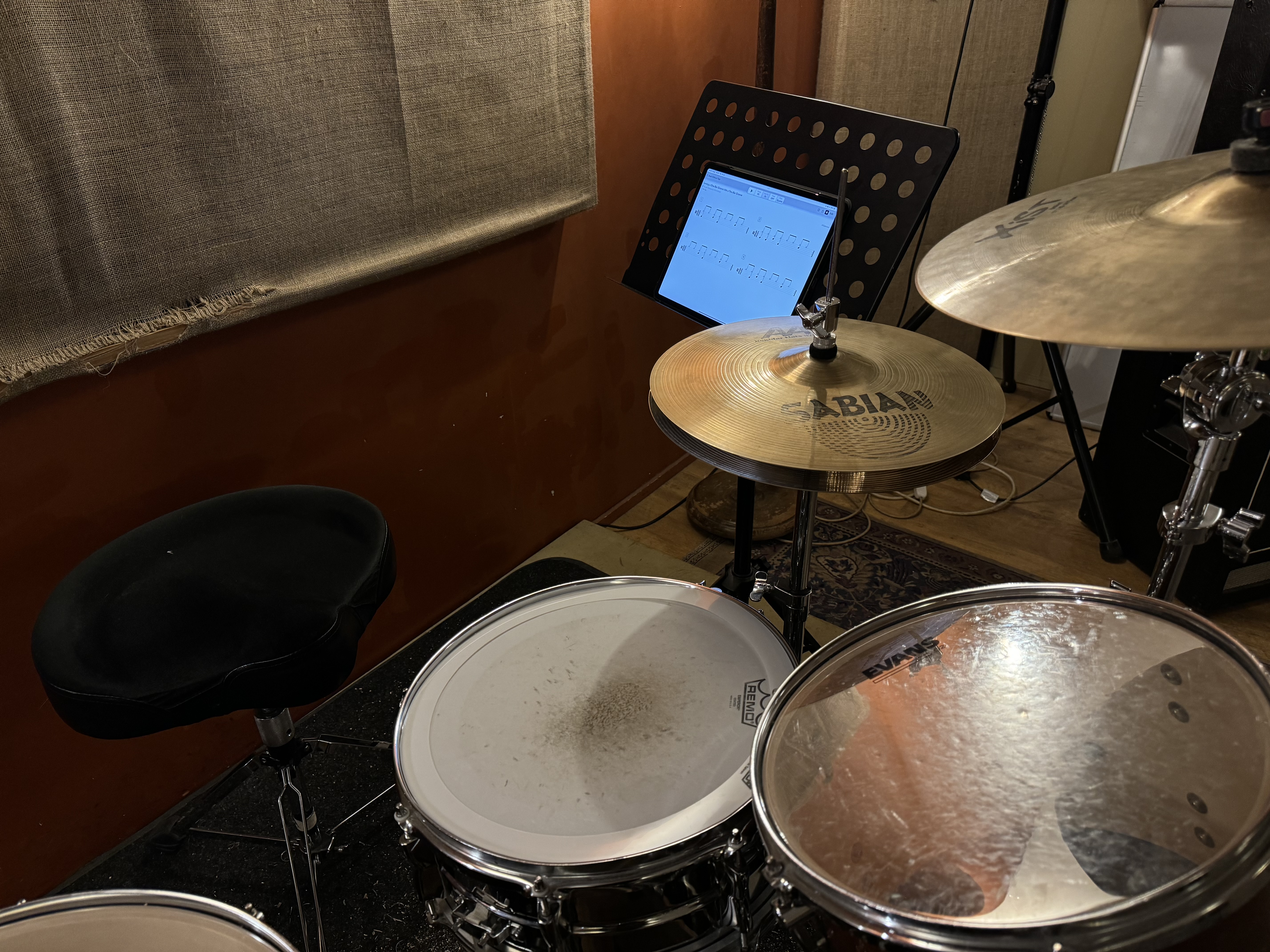 ross farley drum studio using beat note on an ipad on a music stand